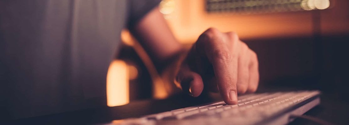 Finger on computer keyboard