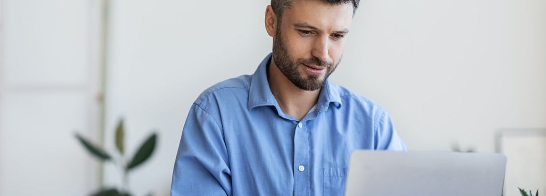 Business Lifestyle. Busy Office Worker Using Laptop At Workplace In Office