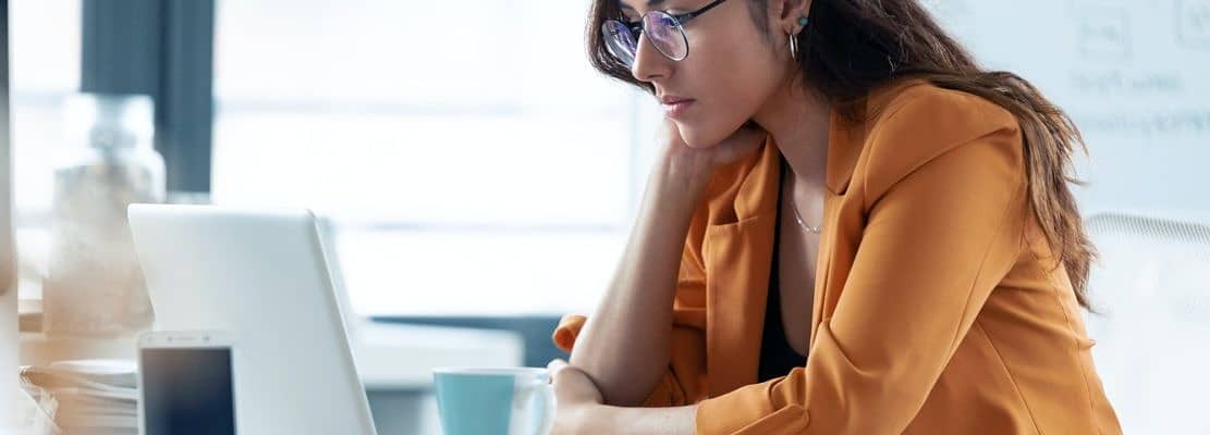 Business young woman working with laptop in the office.