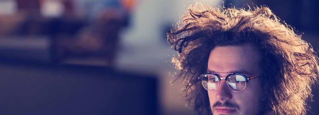 man working on computer in dark office