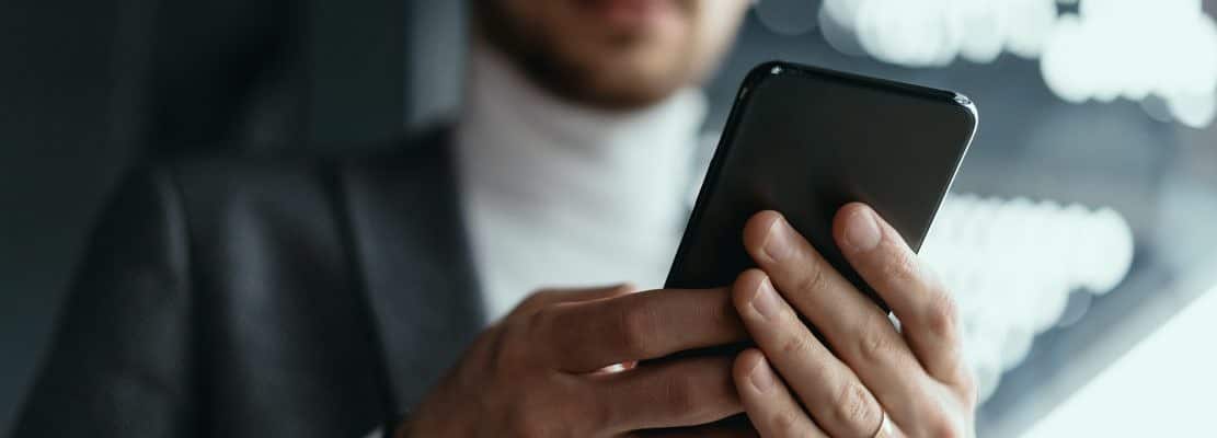 Portrait successful business texting on the smartphone
