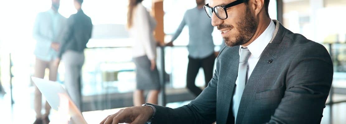 Young businessman working on computer in office