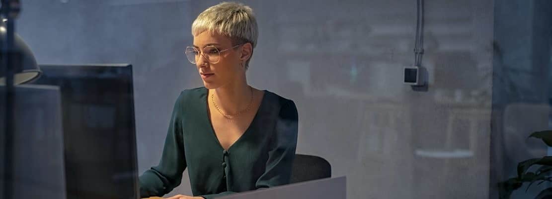 Business woman working late on computer