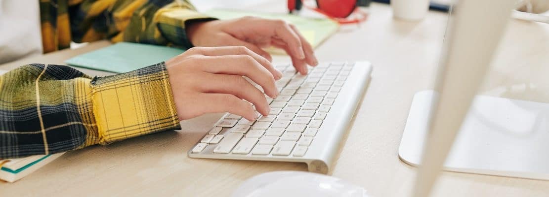 Teenager working on computer