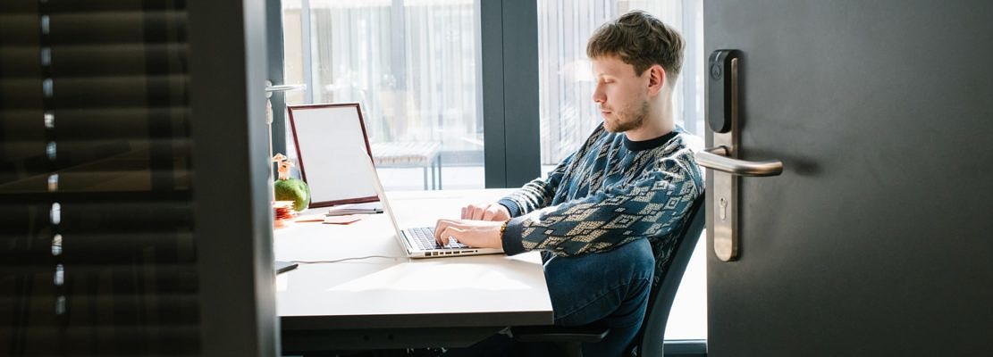 Man working on laptop in office