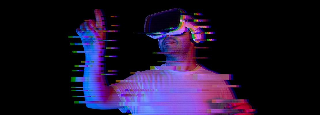 Young man using vr glasses with glitch effect. new virtual world metaverse