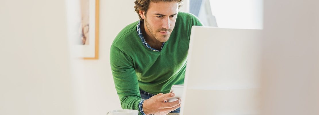Young man working at home office