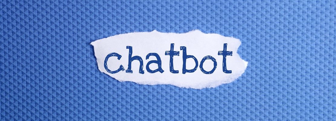 a torn paper written with inscription Chatbot on a blue background