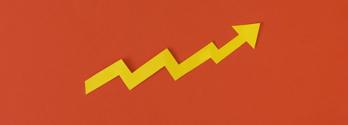 Business growth concept. Financial report with graphs and arrow.