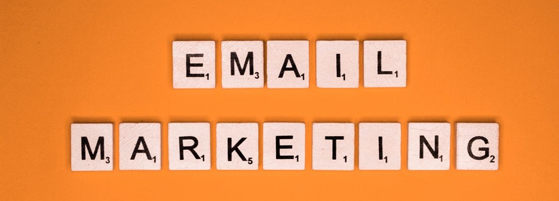 Email marketing scrabble letters word on a orange background