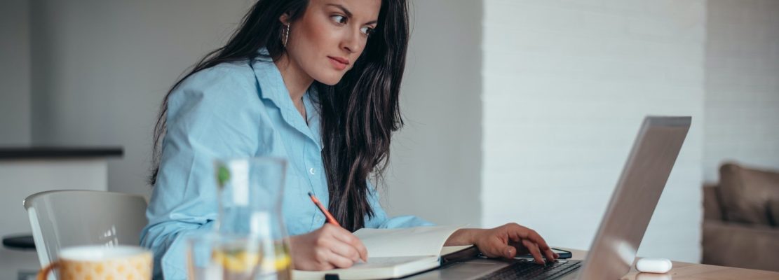 Businesswoman using a laptop while in her office working