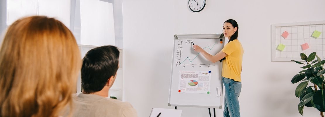 business people in casual clothing having business training in office