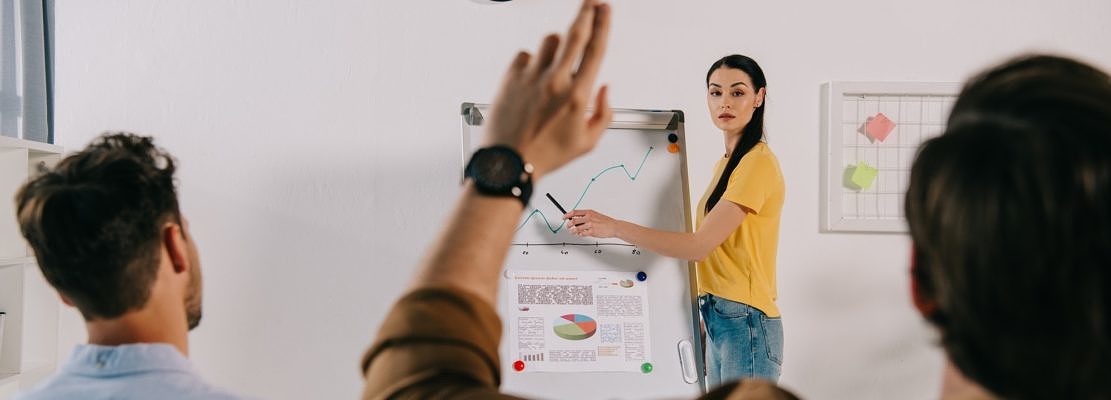 business people in casual clothing having business training in office