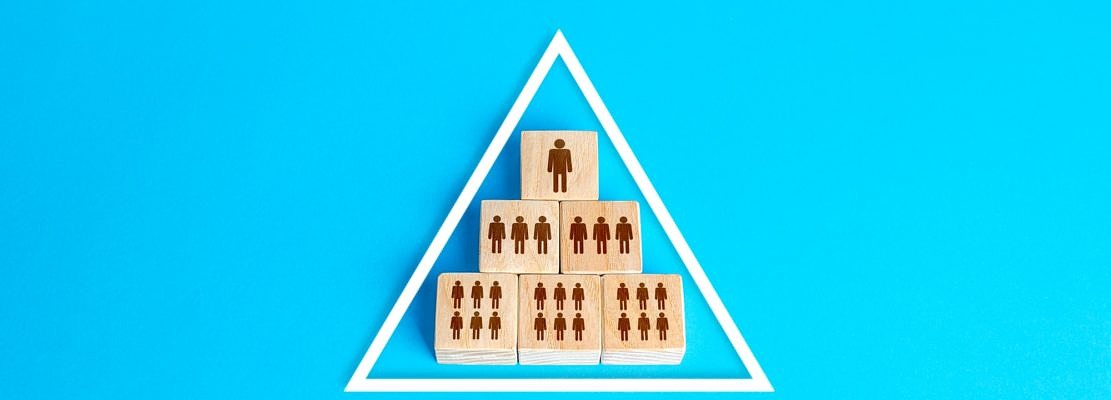 Blocks pyramid symbolizes the hierarchy of society / company organization model. Conformism system