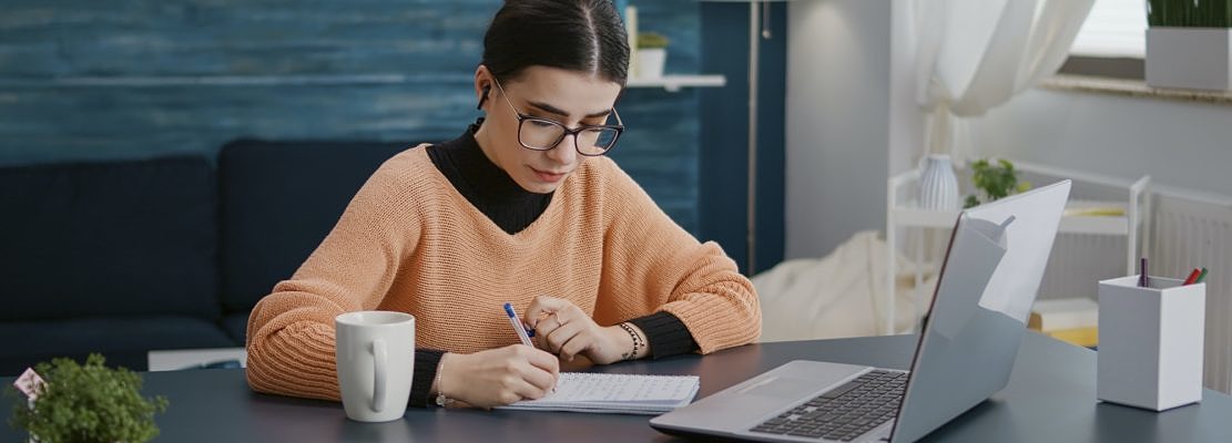 Female student attending online lesson on videoconference
