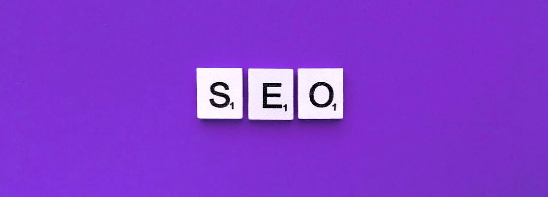 SEO scrabble letters word on a violet background.