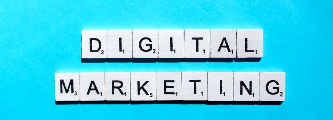 Digital marketing scrabble letters word on a blue background