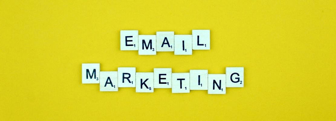 Email marketing- scrabble letters word on a yellow background