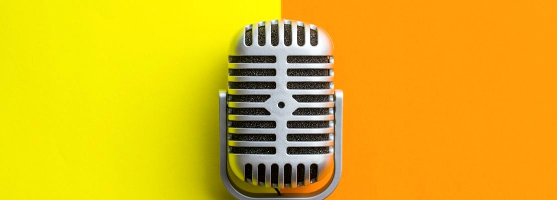 Flat lay of retro microphone.