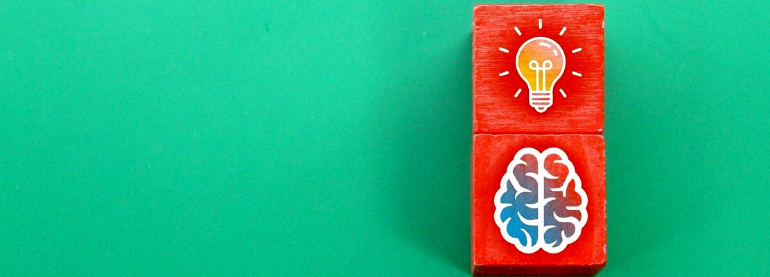 red cube with brain or idea icon.