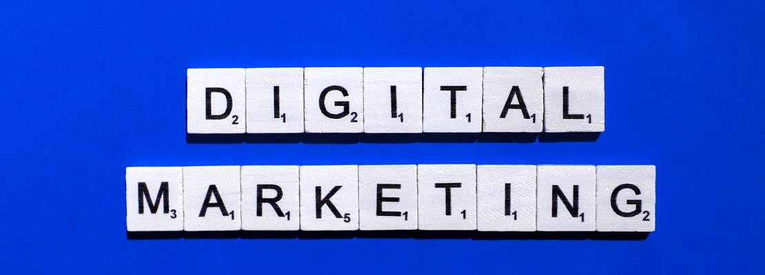 Digital marketing scrabble letters word on a blue background