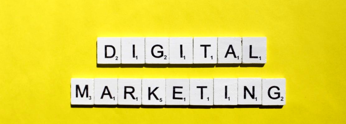 Digital marketing scrabble letters word on a yellow background