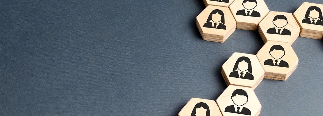 Symbols of employees on the chains of hexagons