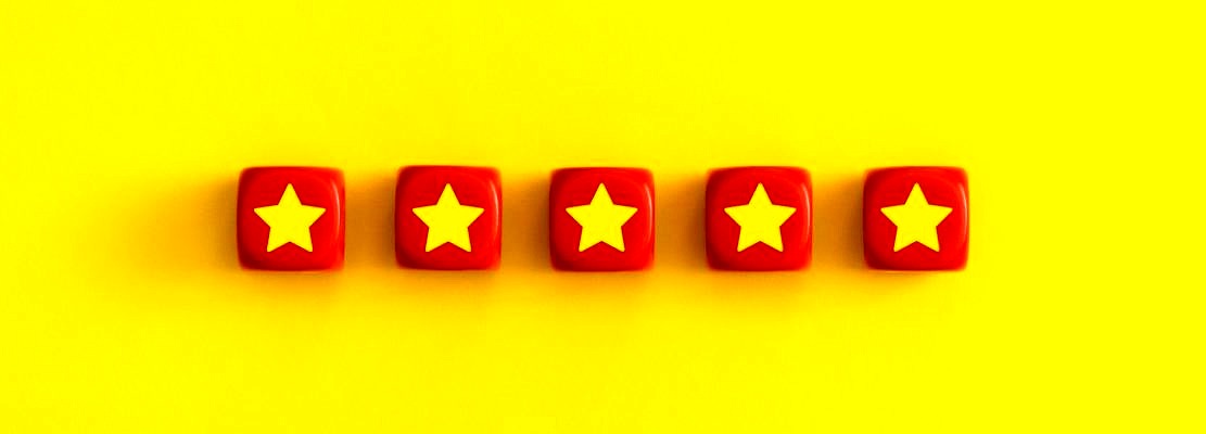 Golden five 5 stars, best excellent services rating on a red cubes