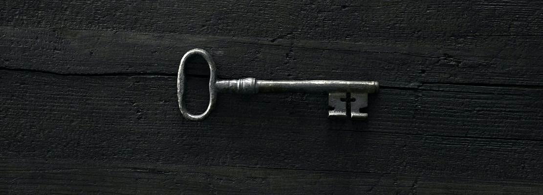 Old key on black backround
