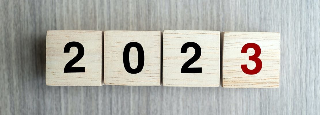 block 2023 text on table.