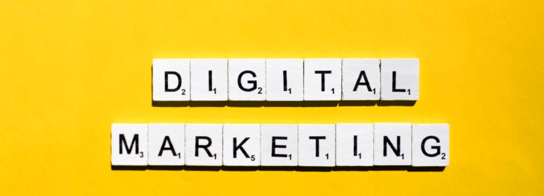 Digital marketing scrabble letters word on a yellow background