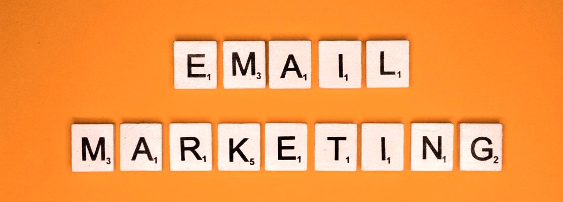Email marketing scrabble letters word on a orange background