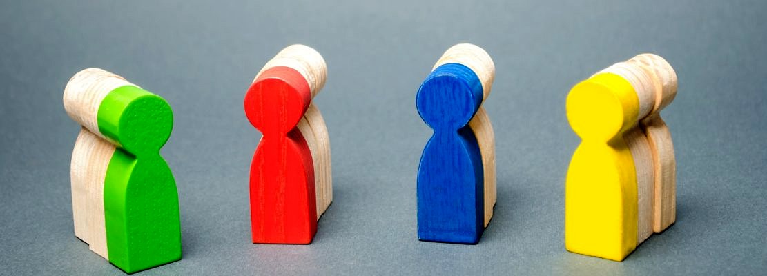 Groups of multicolored wooden people