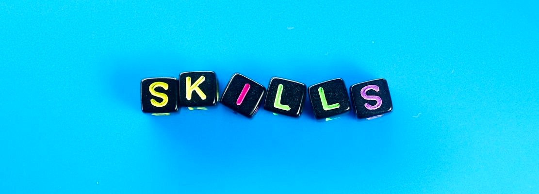 small black cube with the word skills. skill concept
