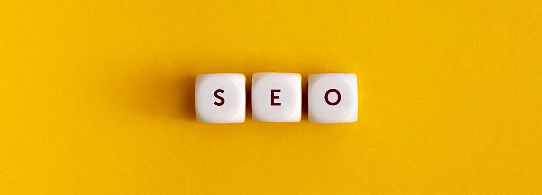 The word seo on yellow background. Top view. Flat lay.