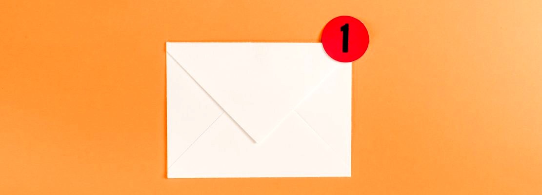 top view of paper envelope with red circle and notification with number 1 isolated on orange