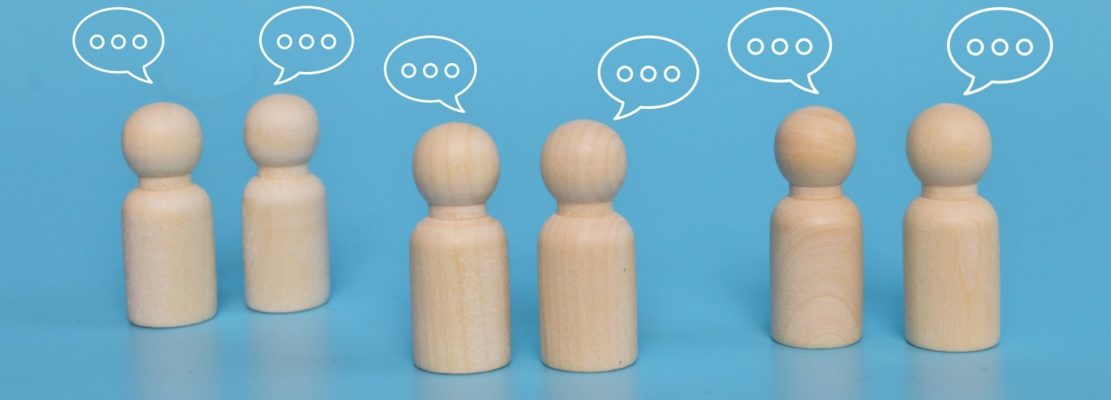 Wooden figure with notification icons of message, chatting social media interactions.