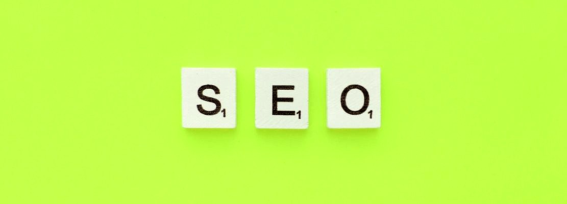 SEO scrabble letters word on a green background
