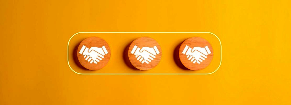 Shaking hands business icons on wooden cube, Business cooperation