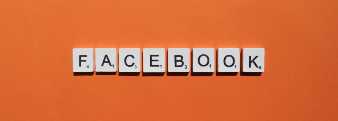 Facebook scrabble letters word on a orange background