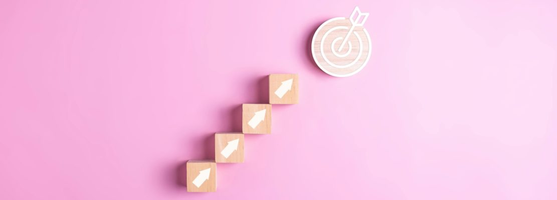 Target and arrow up icons for successful business goal