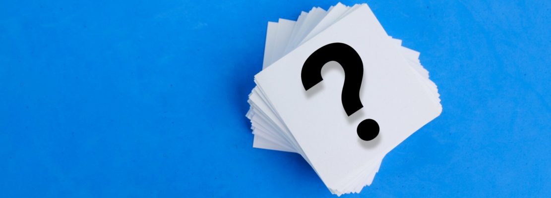 white paper with a question mark or question mark.