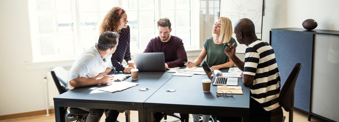 Designers working on a project together in an office