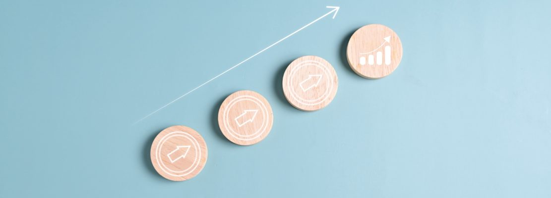 Graph goal icons on wooden blocks, Business strategy planning management