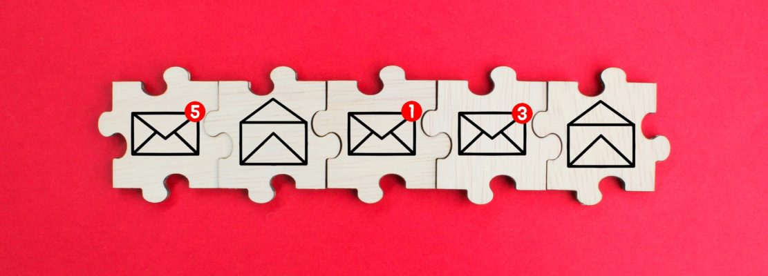 wooden puzzle with read and unread email icons.