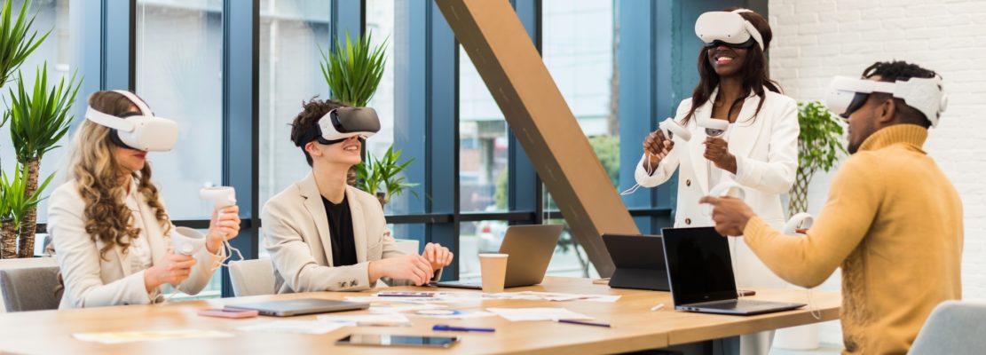 Business conference in VR in an office. Multiracial group of people using VR glasses and controllers