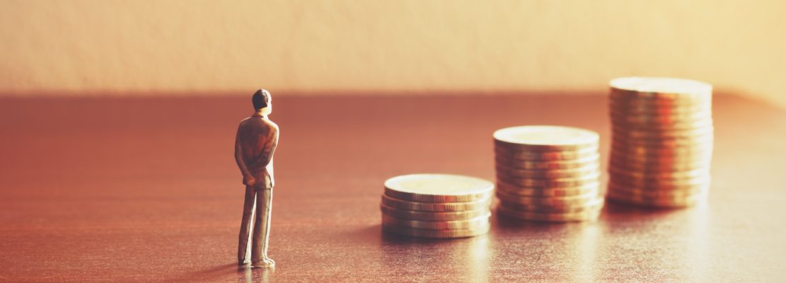 Miniature people looking future with stack coin about financial and money savings concept.