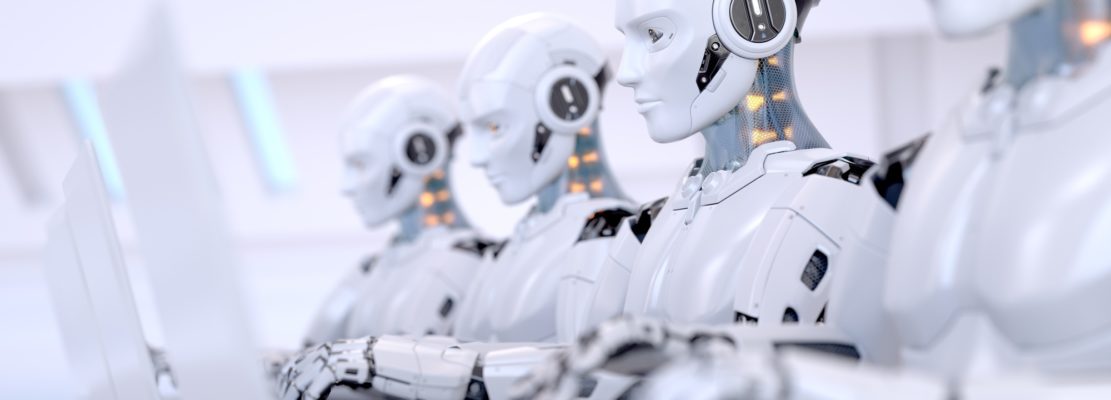 Four Robots working with laptop