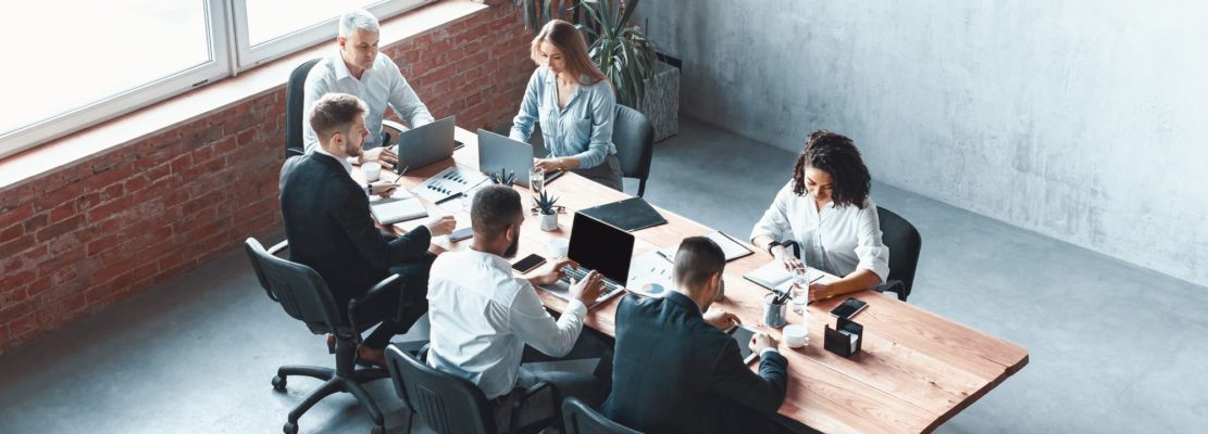 Multiethnic Business Team Working Together Sitting In Modern Office, Panorama
