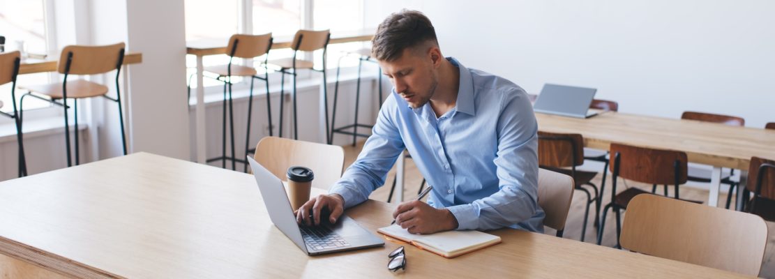 young hipster guy with modern laptop computer e learning education information